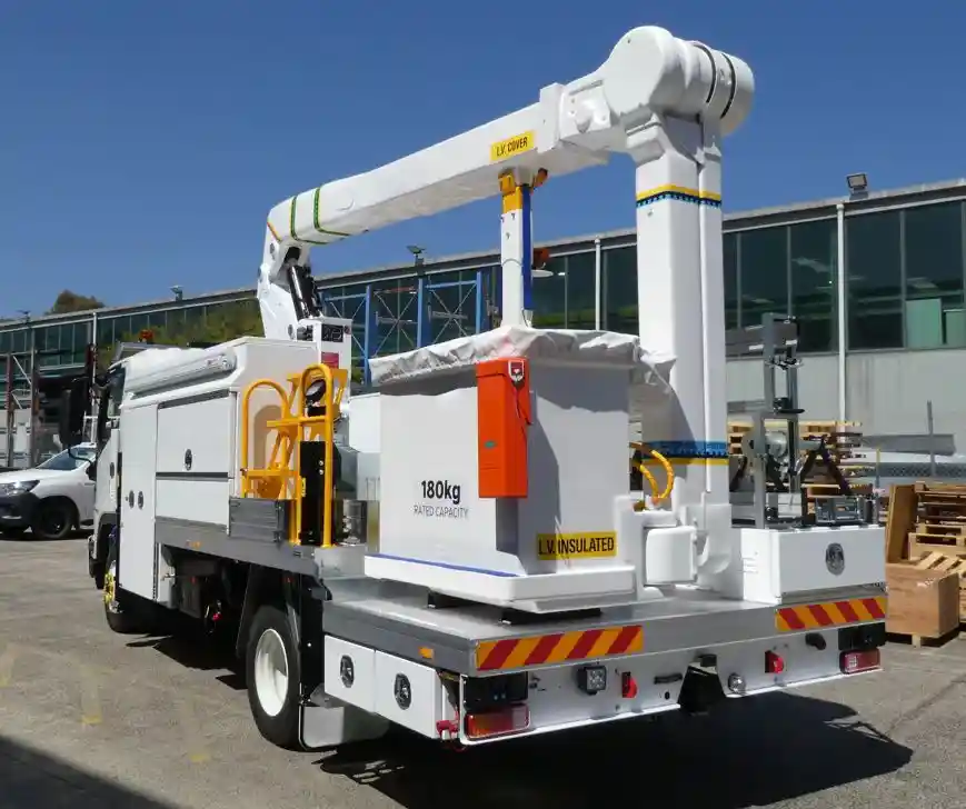 An insulated boom truck AWP in Australia, powered by customized LiFePO4 motive power batteries for maximum uptime and safety.